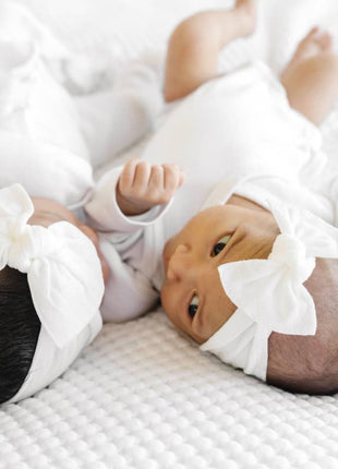 Model Wearing Baby Bling Bows Baby Bling® Itty Bitty Knot Small Soft Nylon Bow Headband