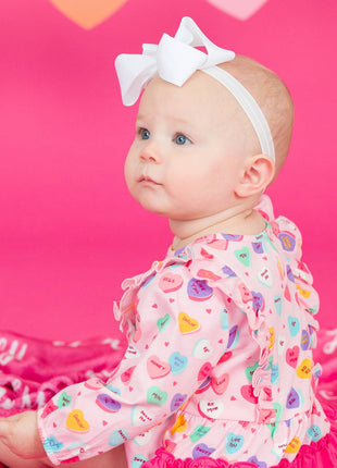 Model Wearing Rufflebutts + Ruggedbutts Baby Girls Be My Valentine Knit Long Sleeve Waterfall Bubble Romper