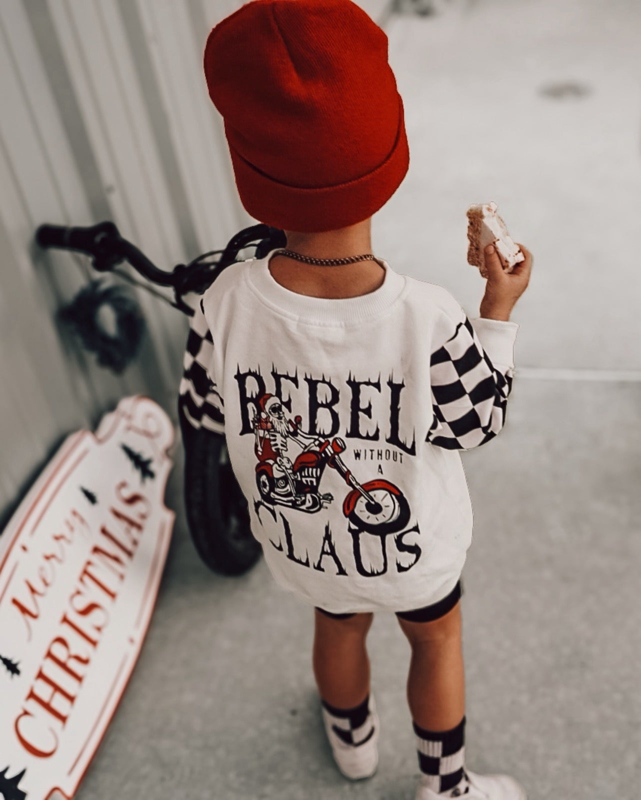 Model Wearing Ak Clothing Co. Rebel Without A Claus-Crewneck Kids