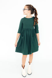 Model Wearing Mila & Rose Spruce 3/4 Sleeve Pocket Twirl Dress