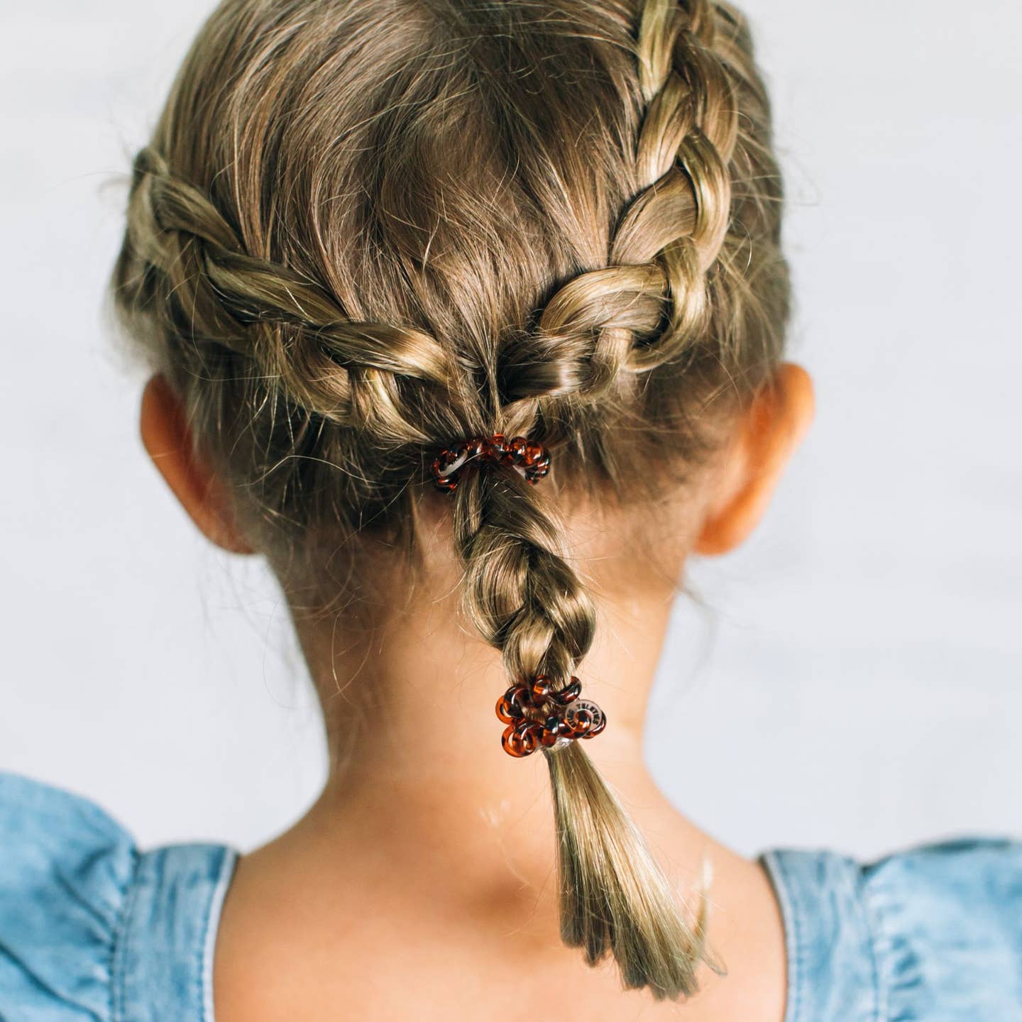 Model Wearing Teleties Spiral Hair Coils | Tiny | Tortoise Hair Ties