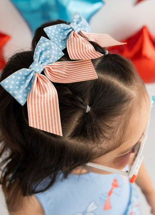 Model Wearing 2 Sweet Winks Patriotic Cutie Bow Clip 