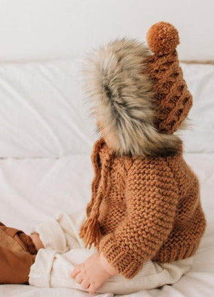 Model Wearing Huggalugs Fur Bonnet In Pecan