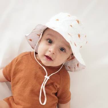 Model Wearing Huggalugs Sunshine Bucket Hat Upf 50+ Baby & Toddler