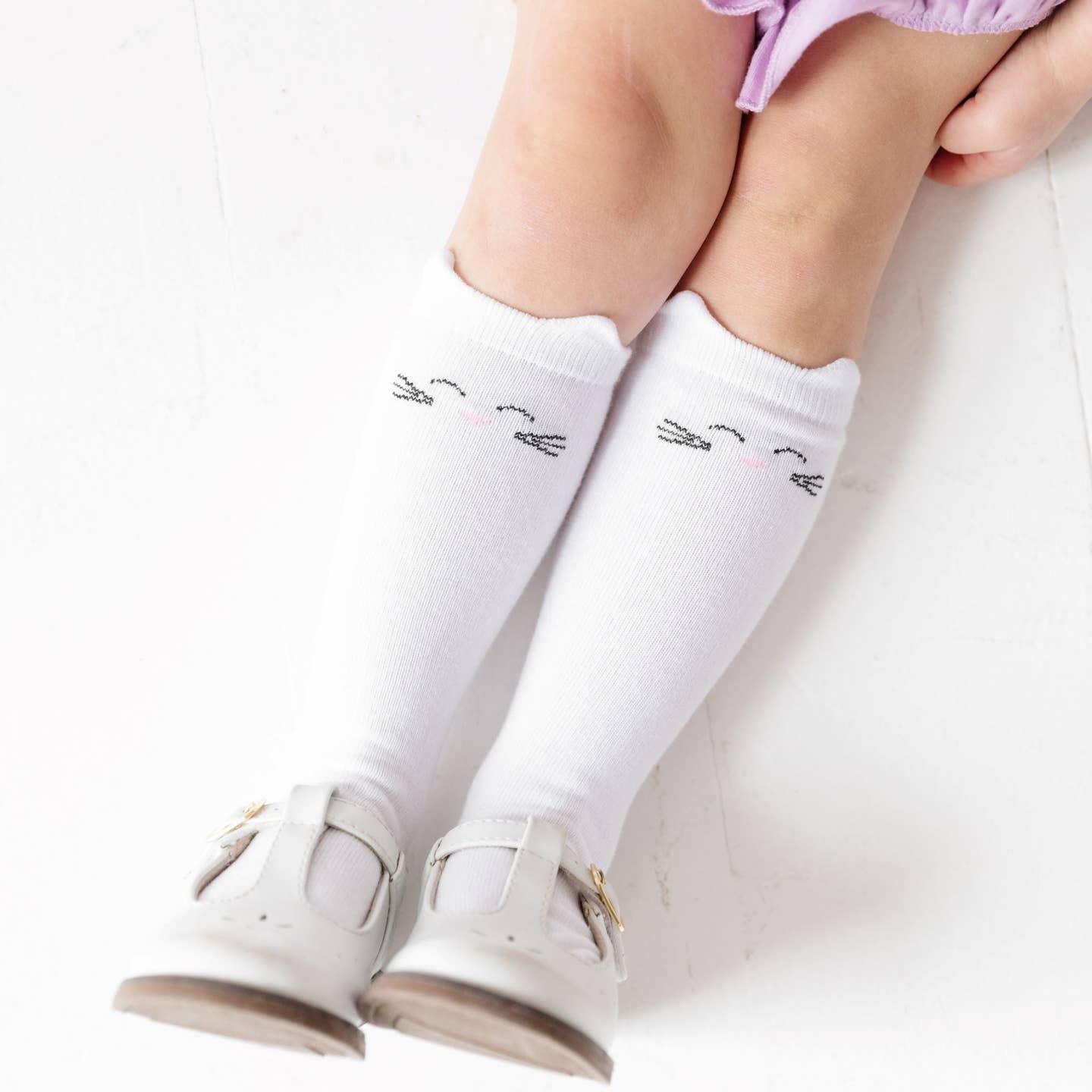 Model Wearing Little Stocking Co. White Cat Knee High Socks