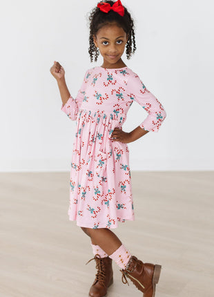 Model Wearing Mila & Rose Candy Cane Cutie 3/4 Sleeve Pocket Twirl Dress
