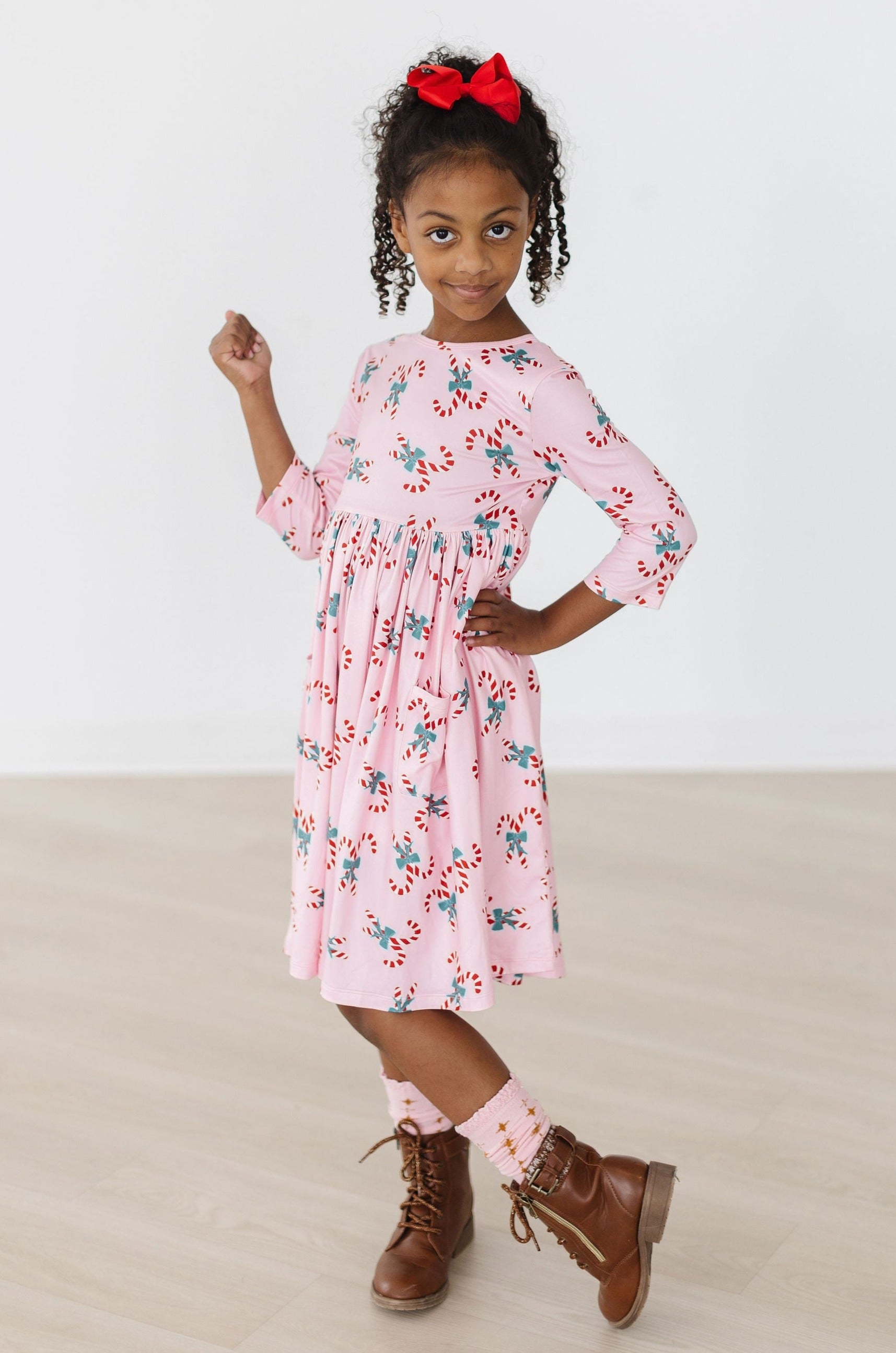 Model Wearing Mila & Rose Candy Cane Cutie 3/4 Sleeve Pocket Twirl Dress