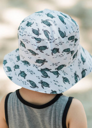 Model Wearing Huggalugs Turtles Bucket Hat Upf 50+ Baby & Toddler