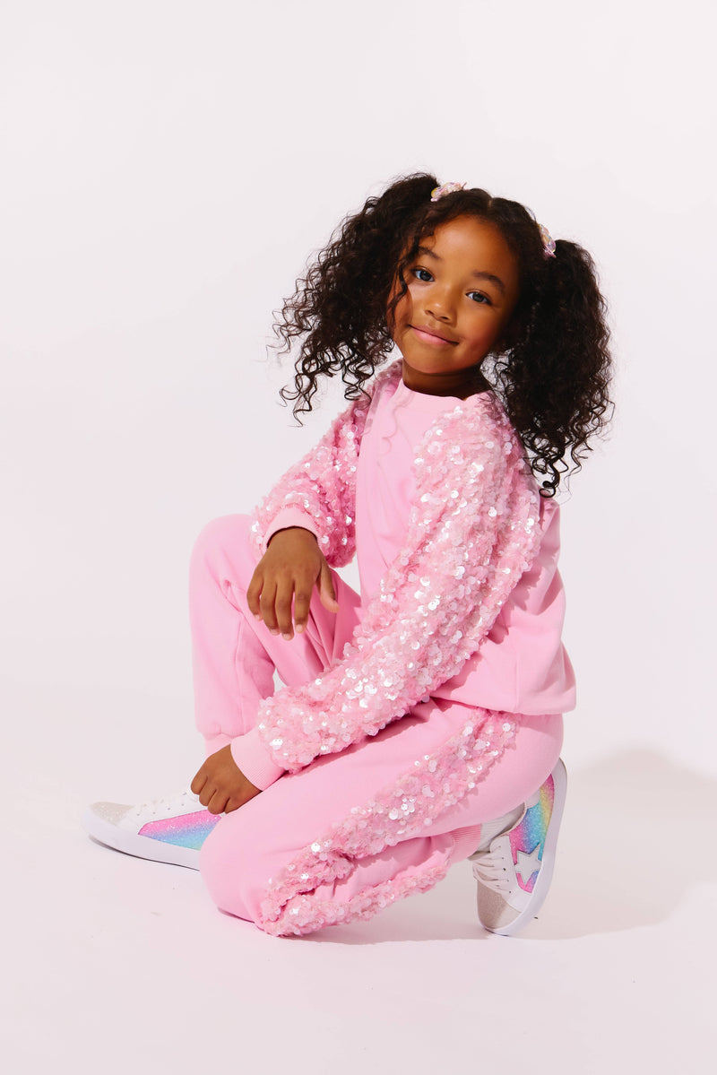 Model Wearing Lola And The Boys Pink Sequin Joggers Set