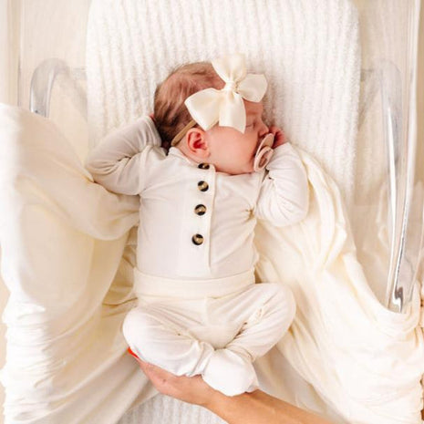 Model Wearing Lou Lou & Company Satin Bow - Cream Headband
