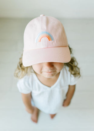 Model Wearing Cash & Co Blushing Rainbow Hat