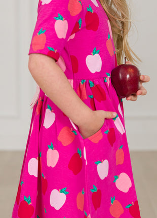Model Wearing Rufflebutts+ Ruggedbutts Girls Apple of My Eye Short Sleeve Knit Twirl Dress