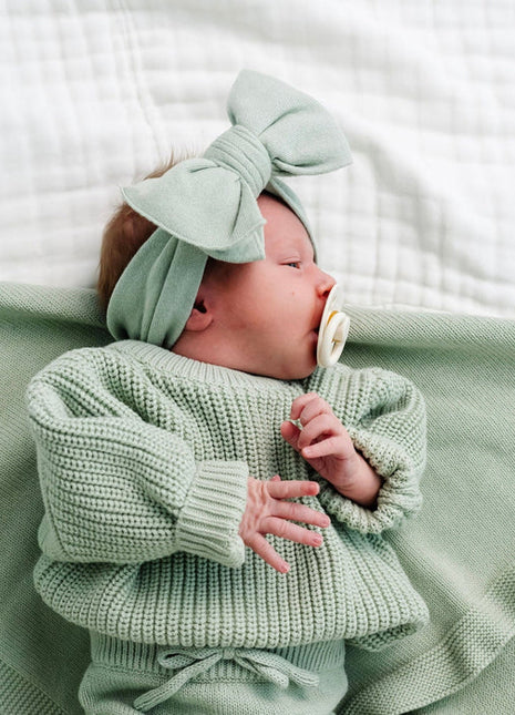 Model Wearing Lou Lou & Company Knit Headband - Sage