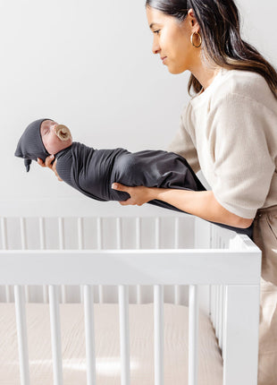 Model Wearing Lou Lou & Company Hudson Ribbed Top Knot Hat